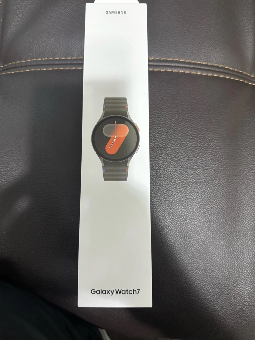 Samsung Galaxy Watch7 with Olive Green Band and Orange Accent